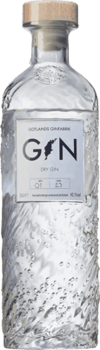 En glasflaska med Gotlands Ginfabrik Dry Gin, en gin & Genever från Sverige