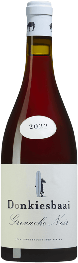 En glasflaska med Rust en Vrede Donkiesbaai Grenache Noir 2022, ett rött vin från Western Cape i Sydafrika