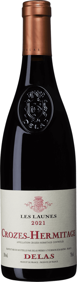 En glasflaska med Delas Les Launes Crozes-Hermitage 2020, ett rött vin från Rhonedalen i Frankrike