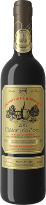 En glasflaska med Chateau De Seguin Cuvée Prestige, ett rött vin från Bordeaux i Frankrike