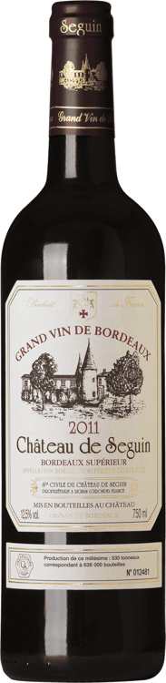 En lättare glasflaska med Château de Seguin, ett rött vin från Bordeaux i Frankrike