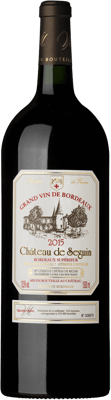 En glasflaska med Château de Seguin Magnum, ett rött vin från Bordeaux i Frankrike