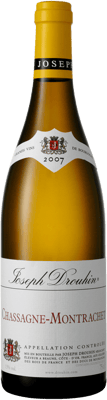 En glasflaska med Chassagne-Montrachet Joseph Drouhin, ett vitt vin från Bourgogne i Frankrike