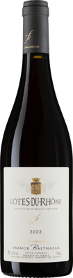 En lättare glasflaska med Franck Balthazar Côtes-du-Rhône, ett rött vin från Rhonedalen i Frankrike