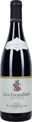 En glasflaska med Saint-Joseph Les Granilites M Chapoutier, ett rött vin från Rhonedalen i Frankrike