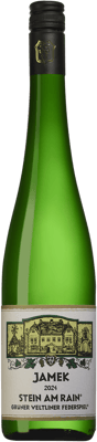 En glasflaska med Jamek Stein am Rain, ett vitt vin från Niederösterreich i Österrike