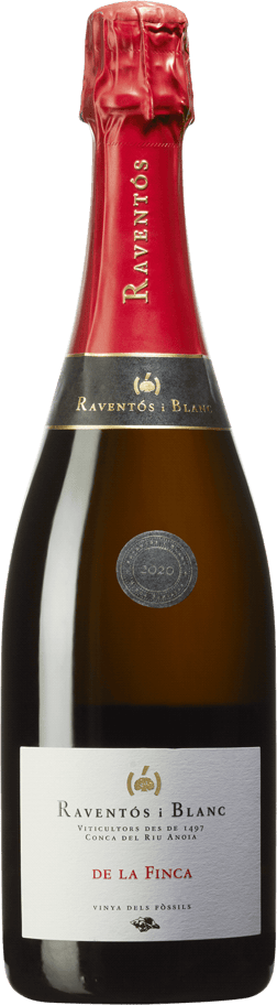 En glasflaska med Raventós i Blanc De la Finca 2018, ett mousserande vin från Spanien
